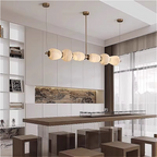 Alabaster linear chandelier in a modern art deco dining room interior