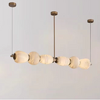 Spanish alabaster linear chandelier with a copper frame in a modern interior