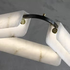 Alabaster chandelier in a black classic interior with refined architectural details