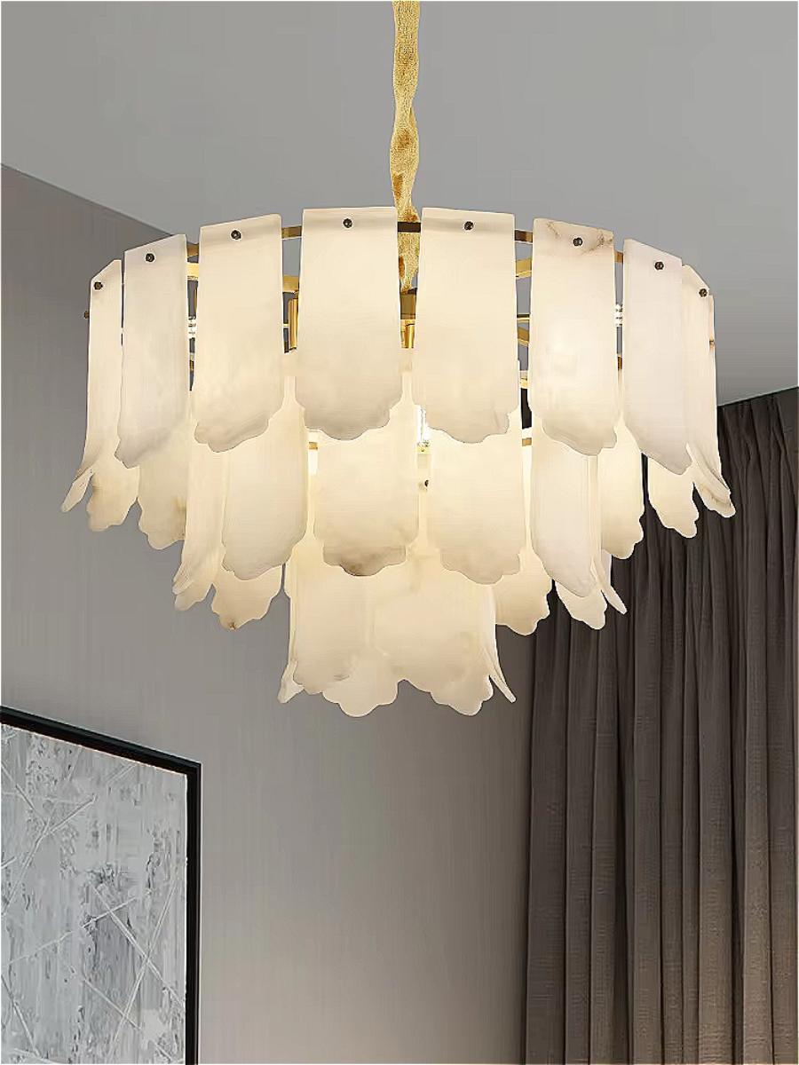 Sculptural alabaster chandelier hanging over a contemporary dining room with modern luxury styling