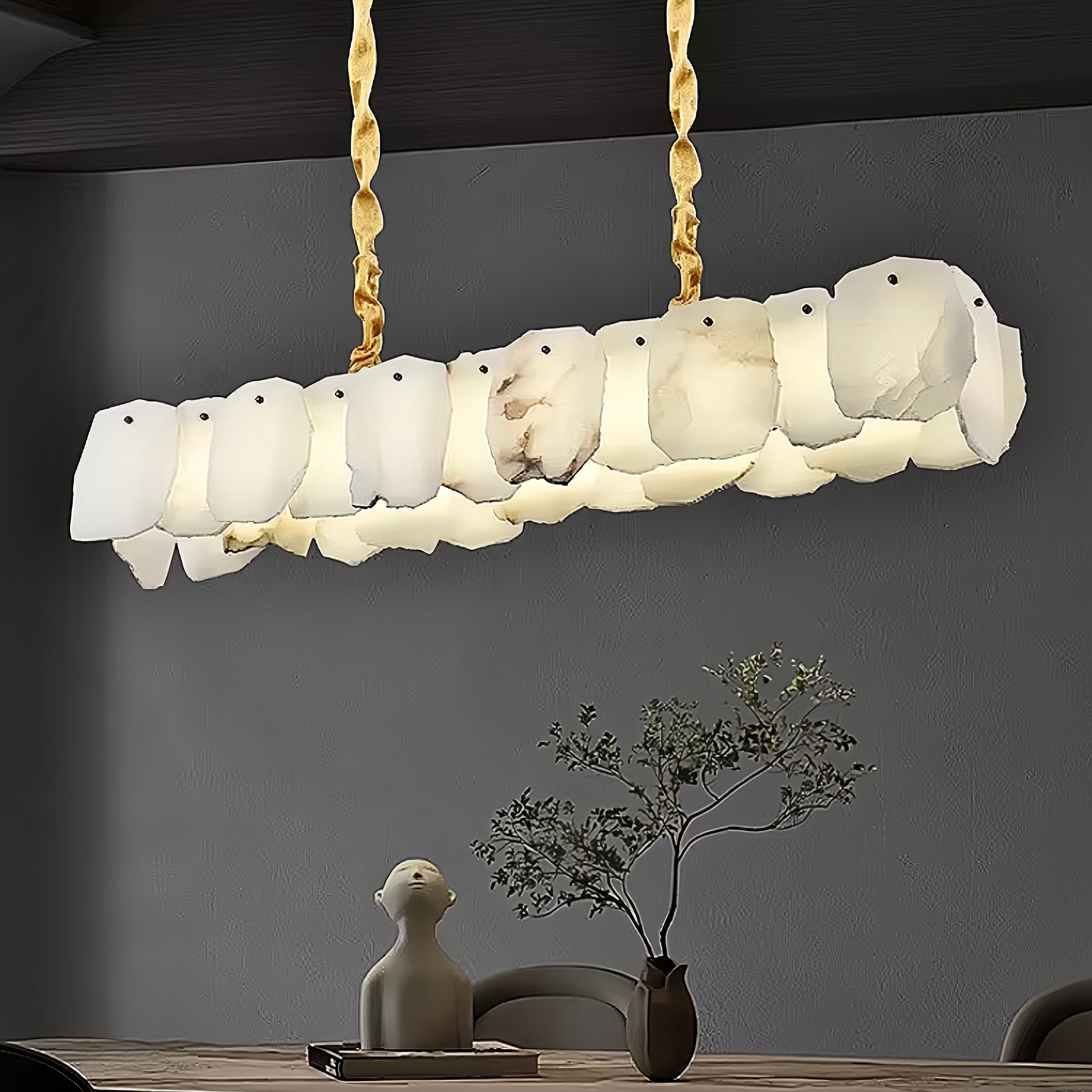 Alabaster linear chandelier in quiet luxury dining room, gold sculptural pendant lighting in modern neutral interior