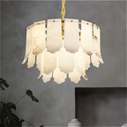 Alabaster pendant chandelier installed in a modern dining room creating soft ambient light