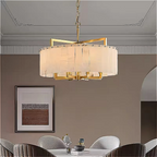 Alabaster drum chandelier in a neutral modern dining room with quiet luxury styling