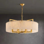 Gold alabaster drum chandelier in a neutral interior living space