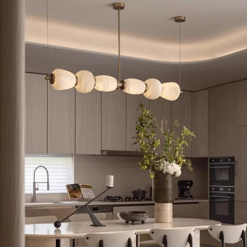 Alabaster linear pendant chandelier in a contemporary dining room interior