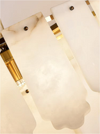 Luxury alabaster pendant chandelier enhancing a modern dining space with clean architectural lines