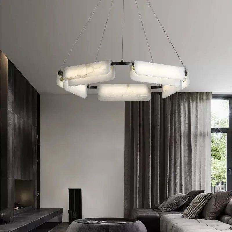 Round alabaster LED chandelier in a black modern interior