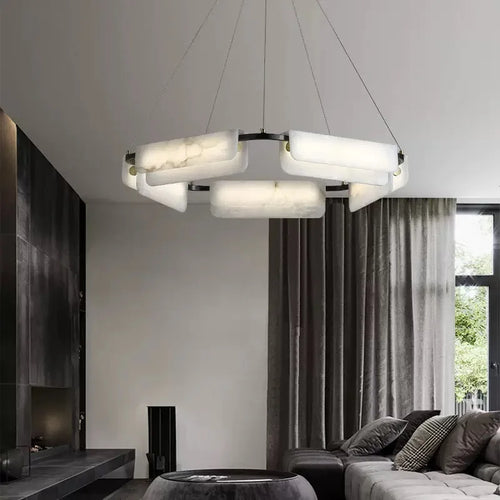 Round alabaster LED chandelier in a black modern interior