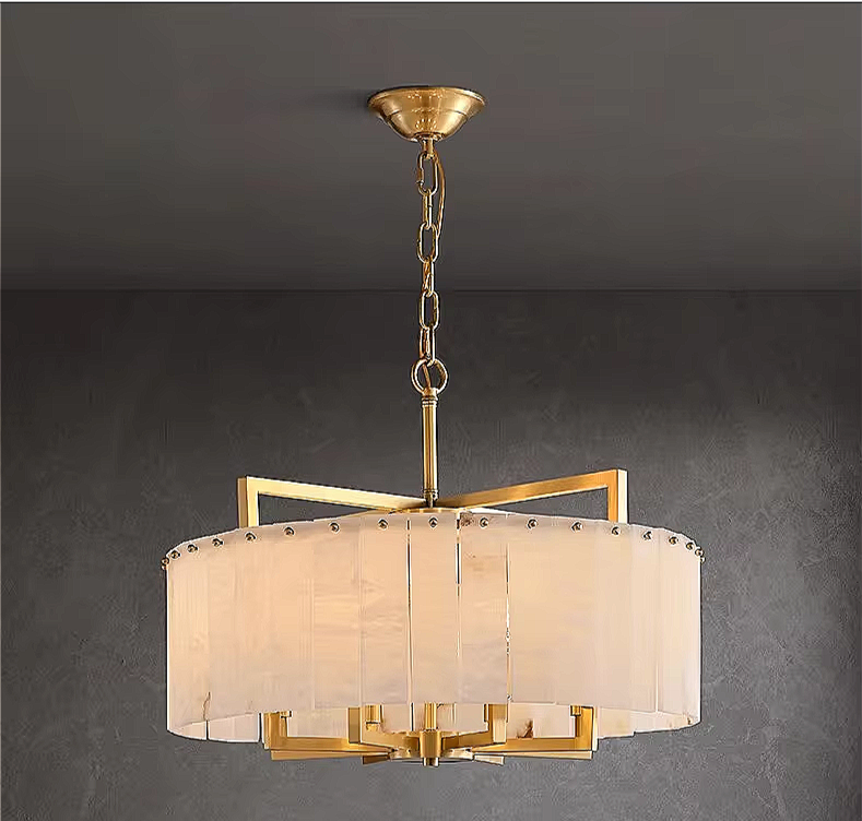 Round alabaster chandelier in a quiet luxury living room interior