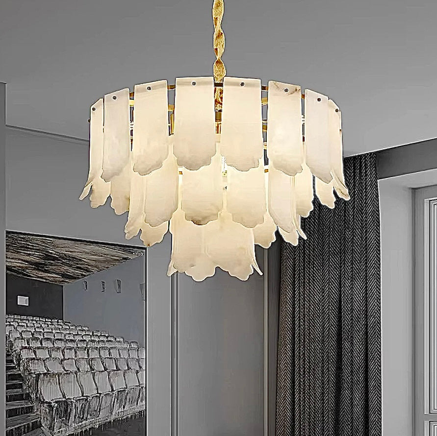 Sculptural alabaster chandelier with leaf-inspired stone panels in a modern luxury interior