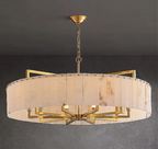 Sculptural alabaster drum chandelier in a contemporary dining room interior