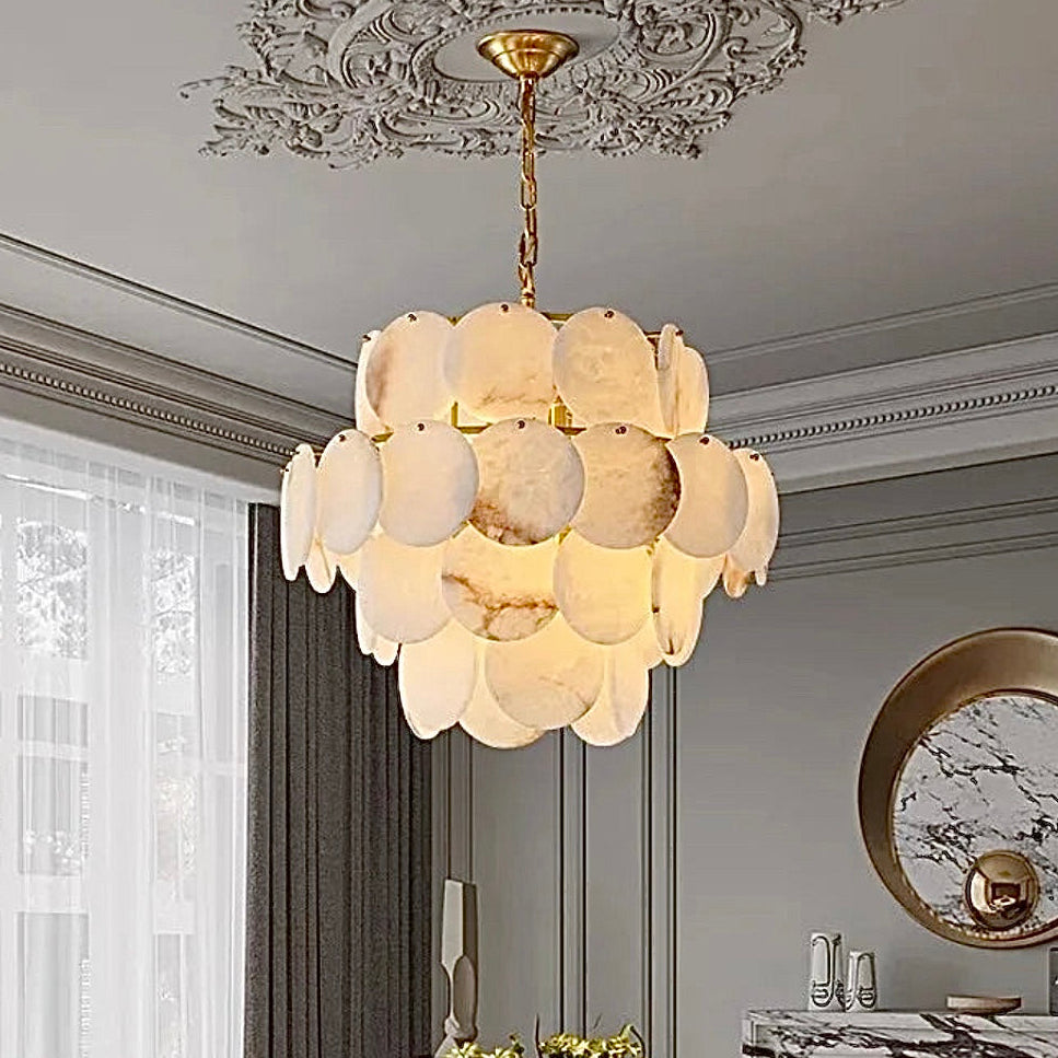 Spanish alabaster chandelier above a modern luxury dining room in natural stone finish