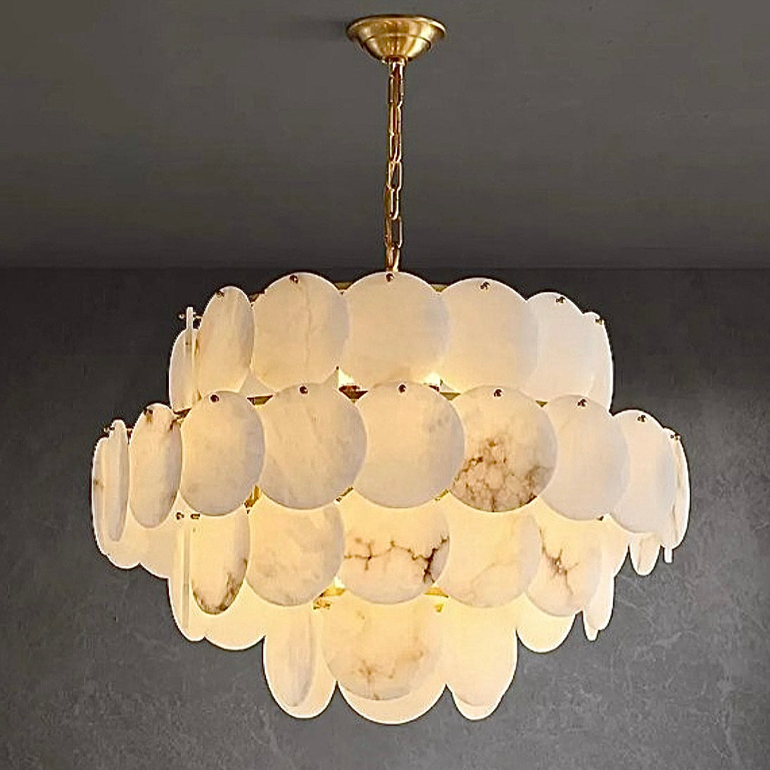 4-tier spanish alabaster chandelier styled in a modern neutral interior with natural stone palette