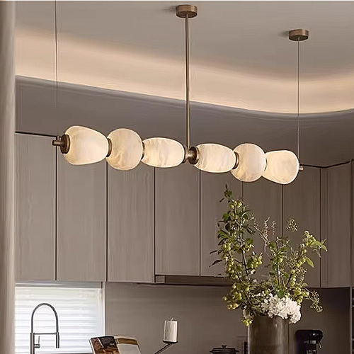 Alabaster linear chandelier in a modern neutral dining room interior